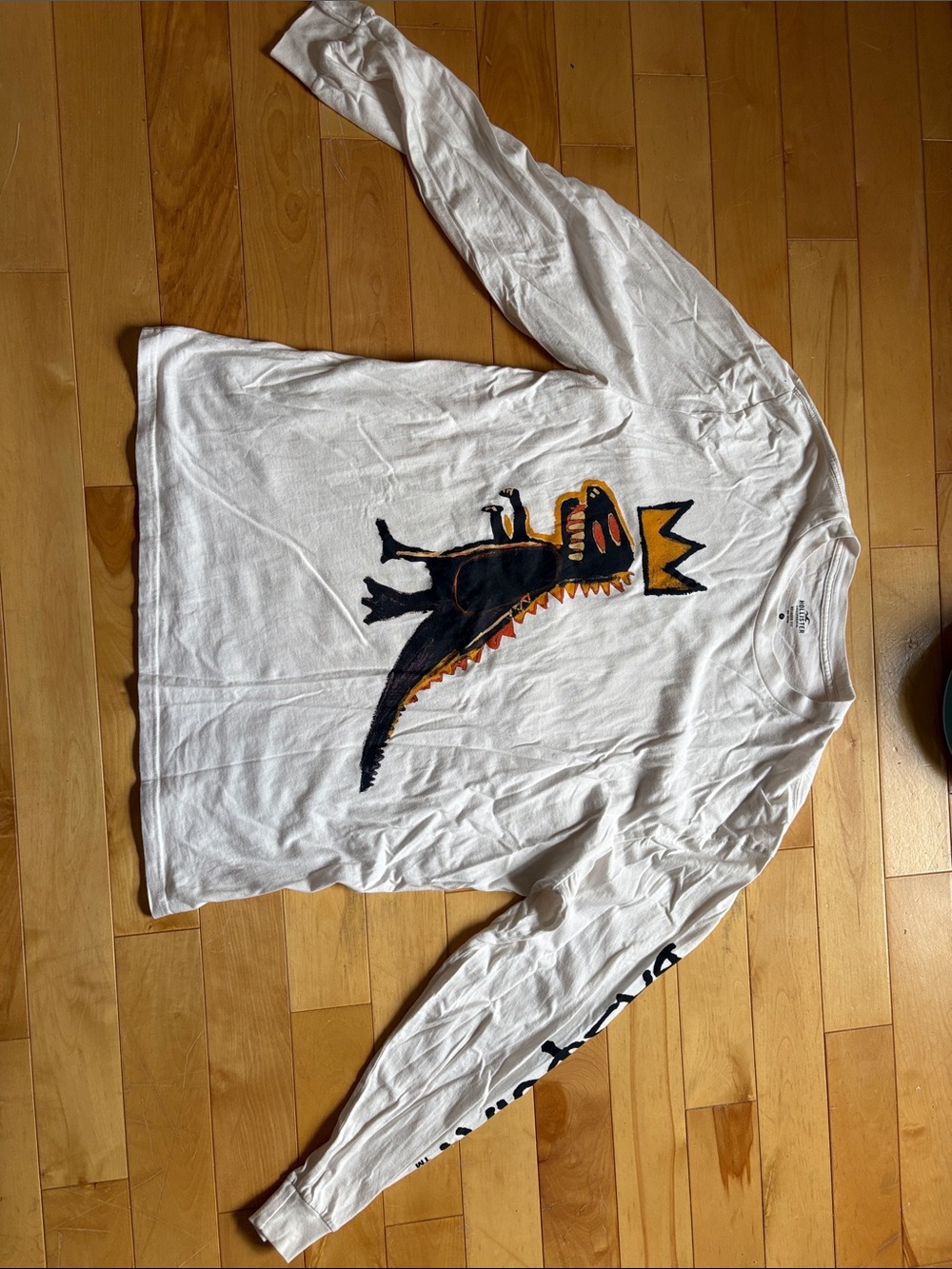 Hollister White Crewneck with Black & Gold Dino Graphic